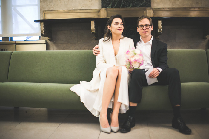 bride and groom waiting at city hall