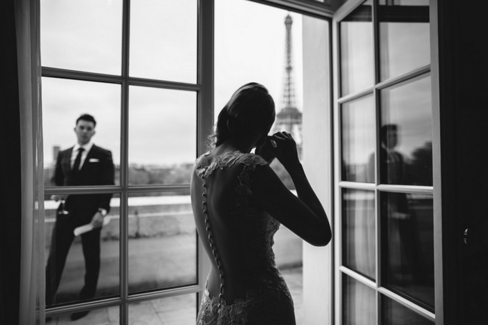 bride putting on earrings