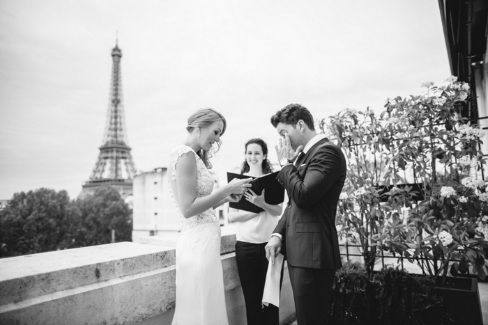 groom wiping away tears during ceremony 