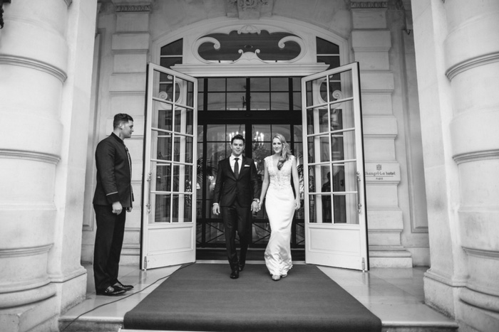 bride and groom leaving hotel