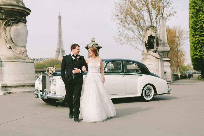 bride and groom portrait in front of vintage car in paris