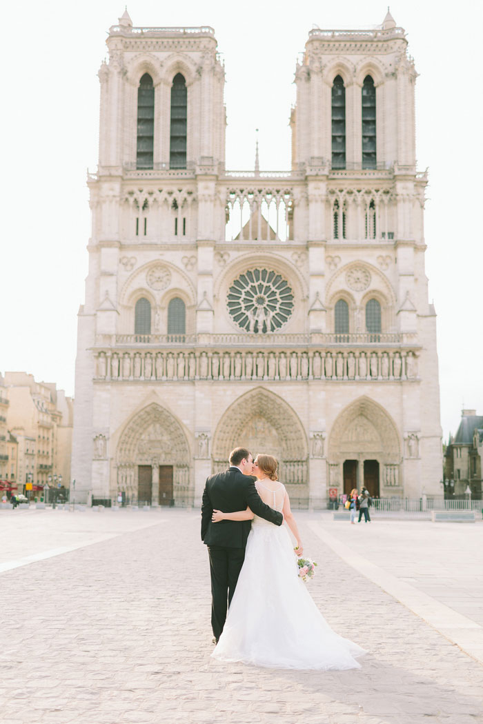 bride and groom portrait in front of Notre Dame Cathedral