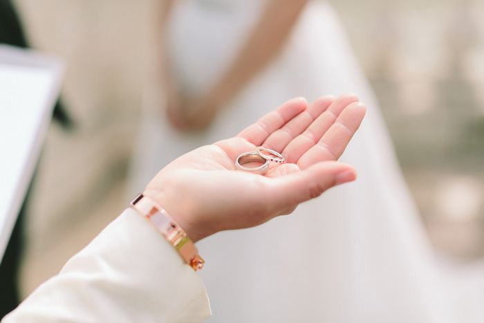 officiant holding out rings