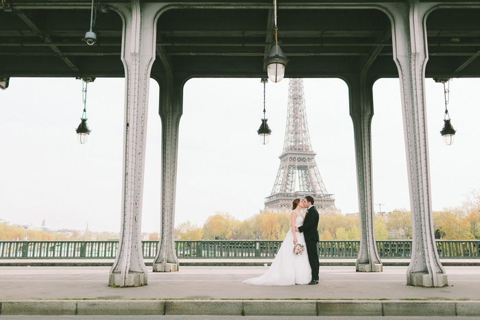 bride and groom portrait in front of eiffel tower