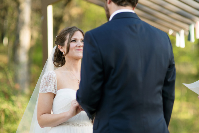 bride looking up at groom during ceremony 