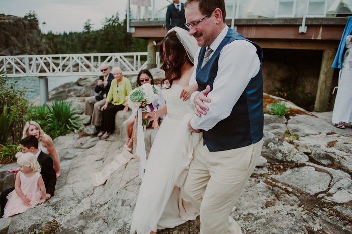 bridewalking down aisle with father