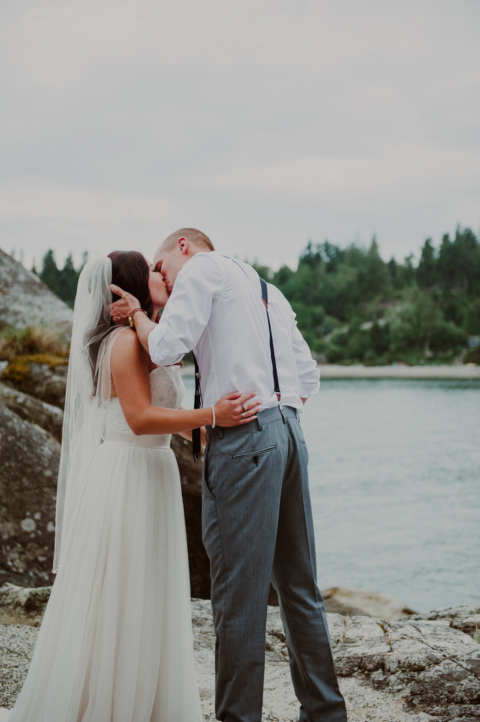 bride and groom first kiss