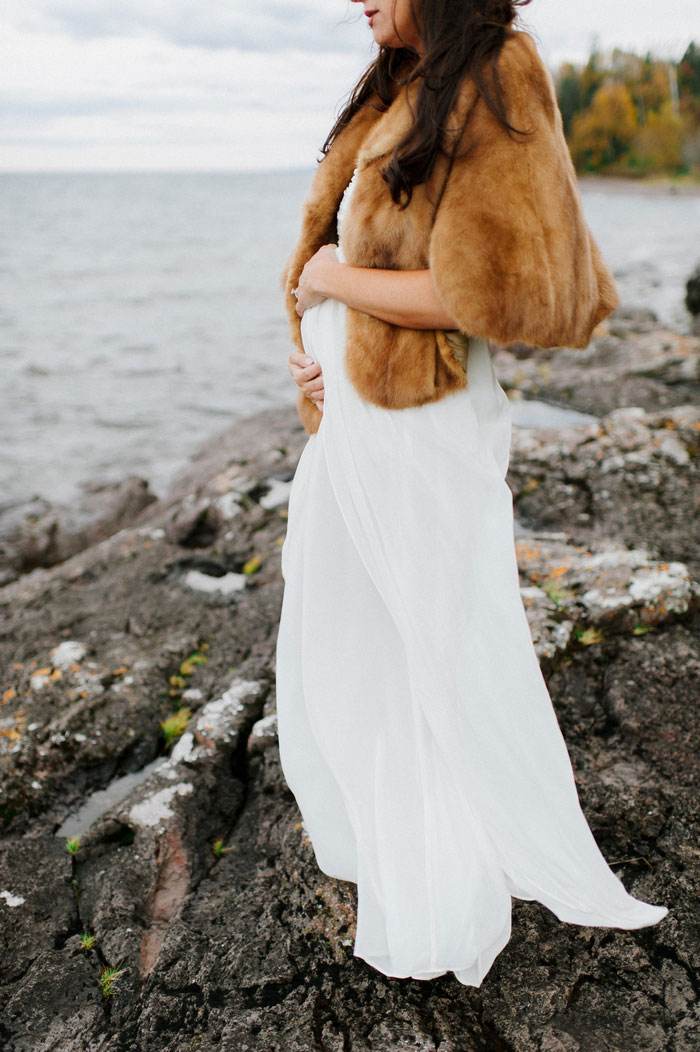 pregnant bride cupping her belly