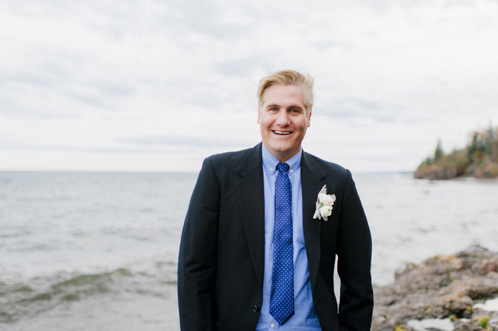 groom portrait by the lake