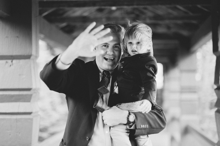 groom holding son