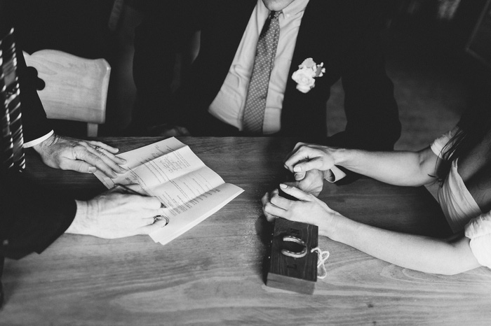 officiant signing marriage certificate