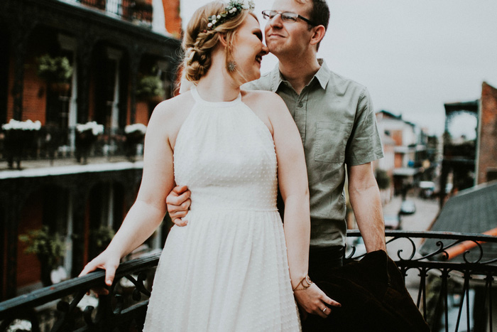 bride and groom portrait on balcony