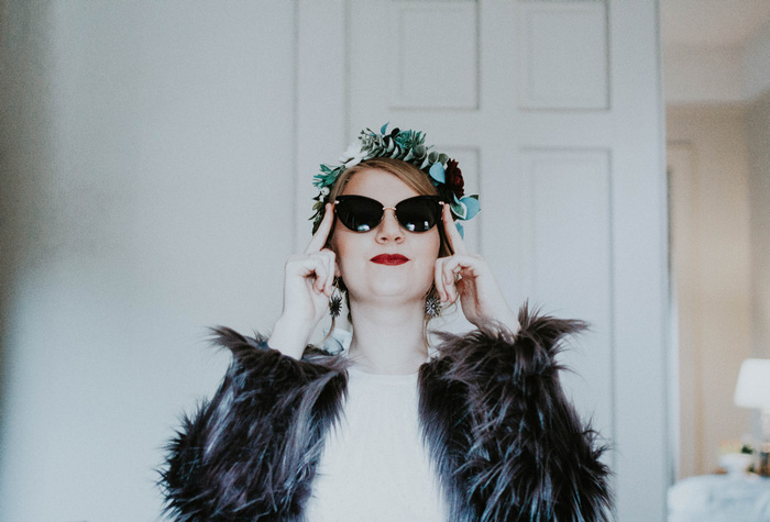 bride putting on sunglasses