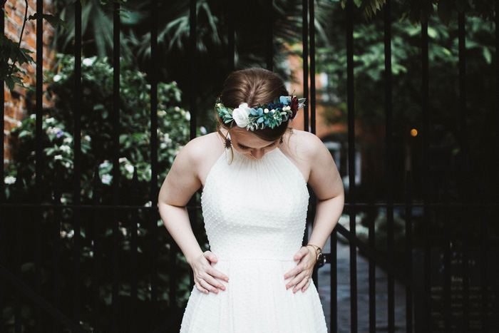 bride smoothing out her dress