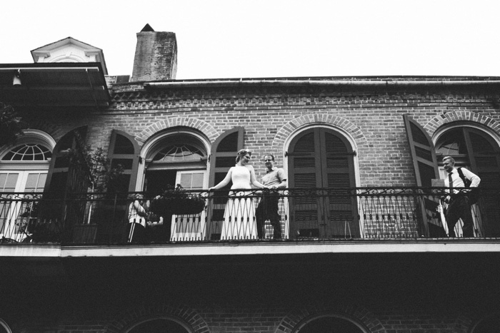 bride and groom on New Orleans balcony