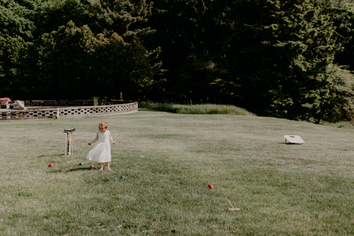 little girl playing croquet