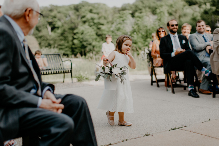 flower girl walking up the aisle