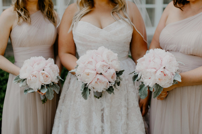 bridal party holding bouquets