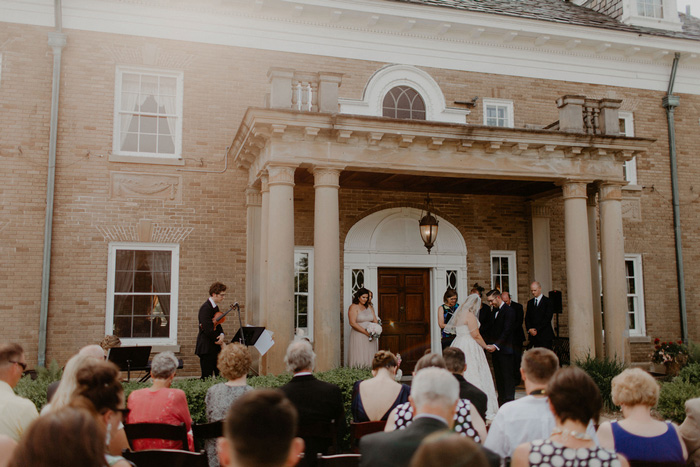 wedding ceremony on estate front lawn