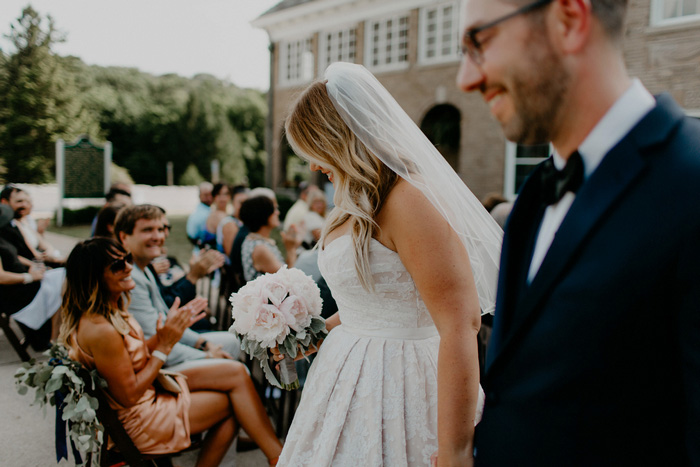 bride and groom walking up aisle