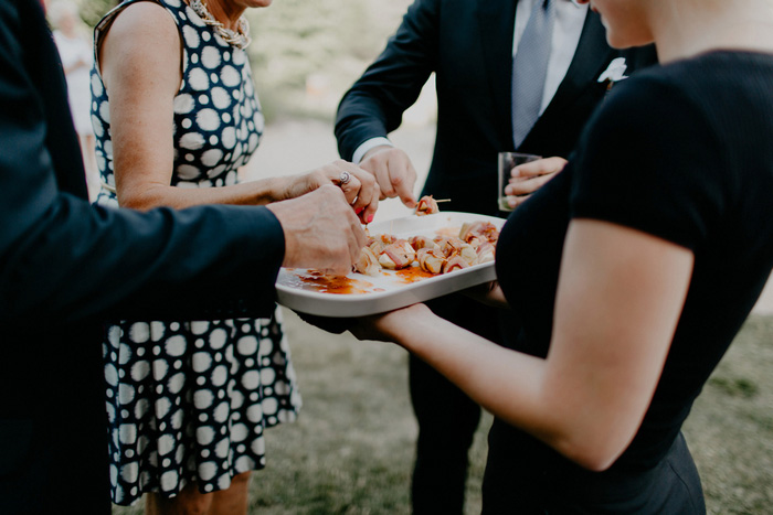 guest taking passed appetizers