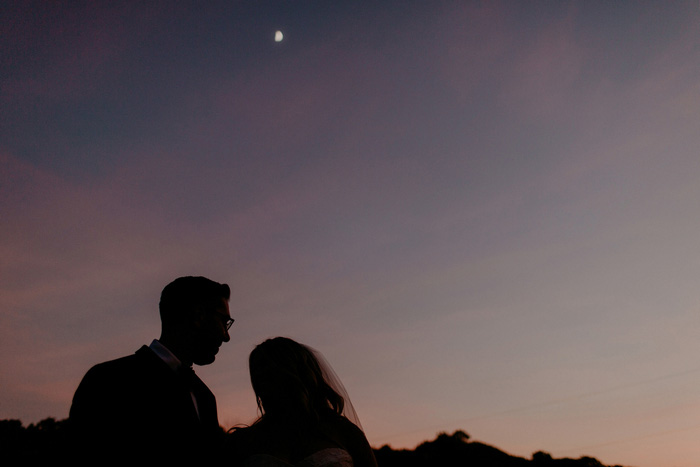 bride and groom silhouette at night