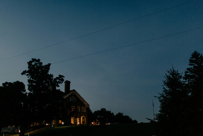 view of outdoor wedding reception at night