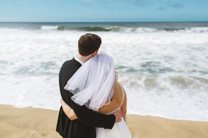 bride and groom portrait on the beach