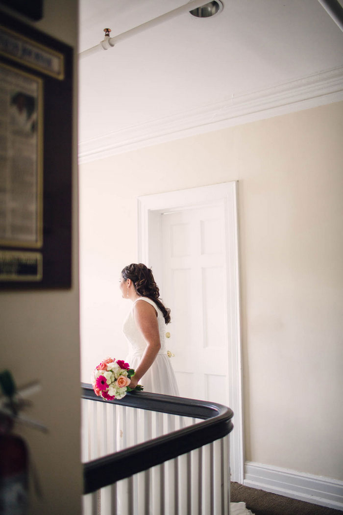 bride at the top of the staircase