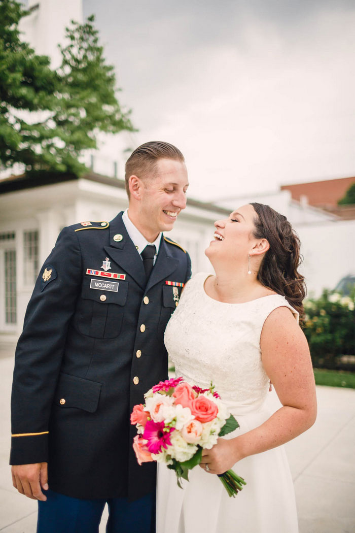 portrait of bride and groom laughing 