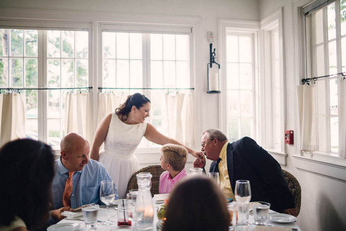 father kissing bride's hand