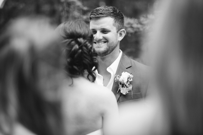 groom grinning during ceremony