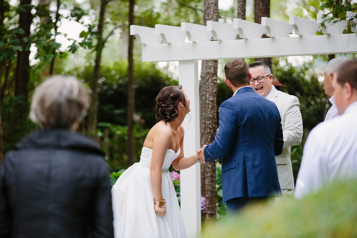 bride laughing during ceremony