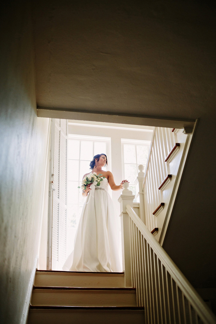 bride portrait at the top of the stairs