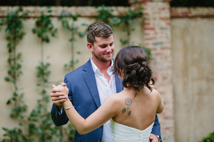 bride and groom dancing in backyard