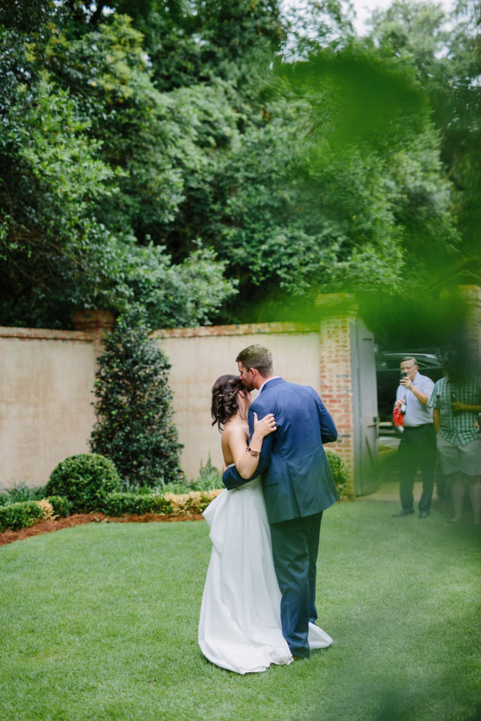 bride and groom dancing in backyard