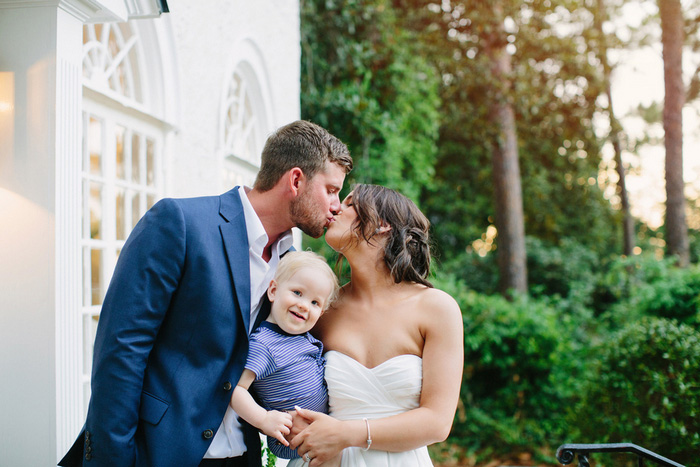 bride and groom portrait with baby