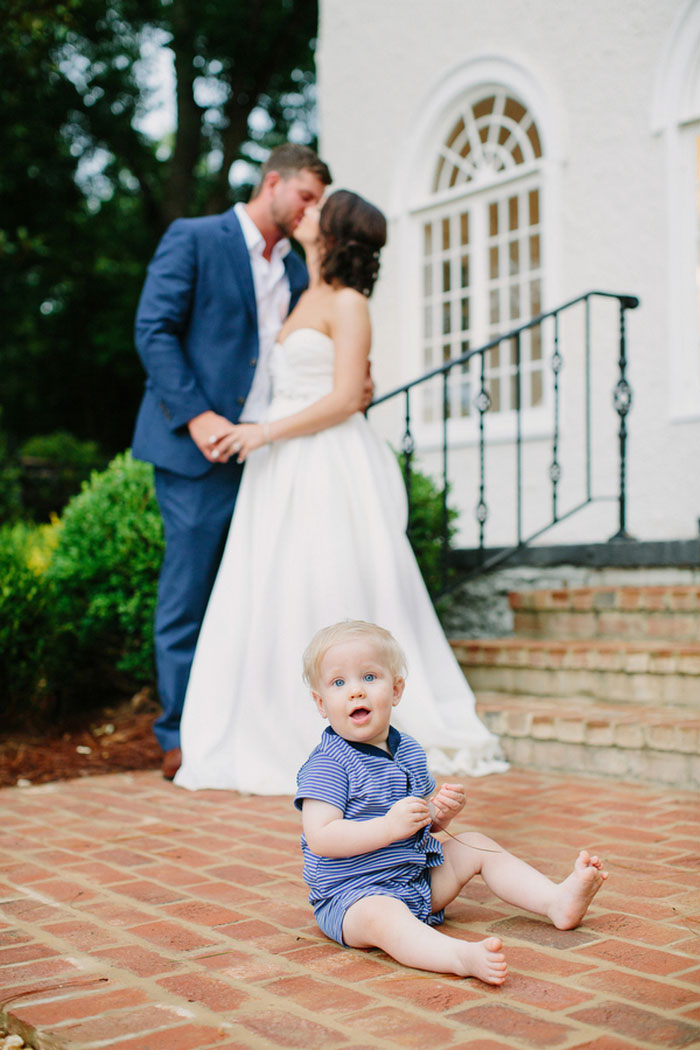 bride and groom portrait with baby