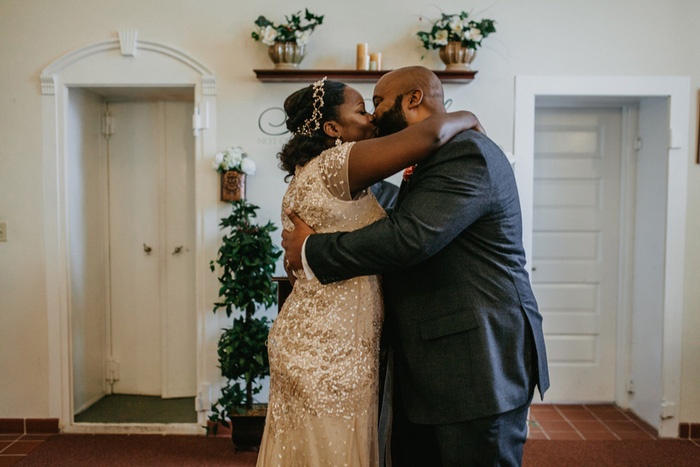 bride and groom first kiss