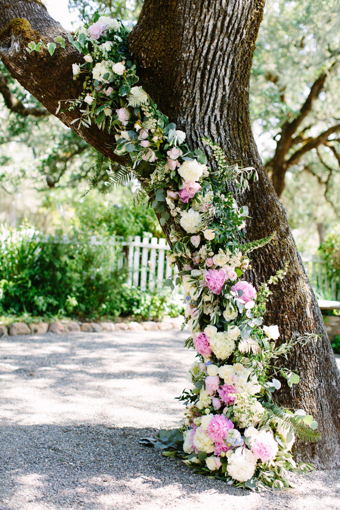 tree covered in wedding flowers