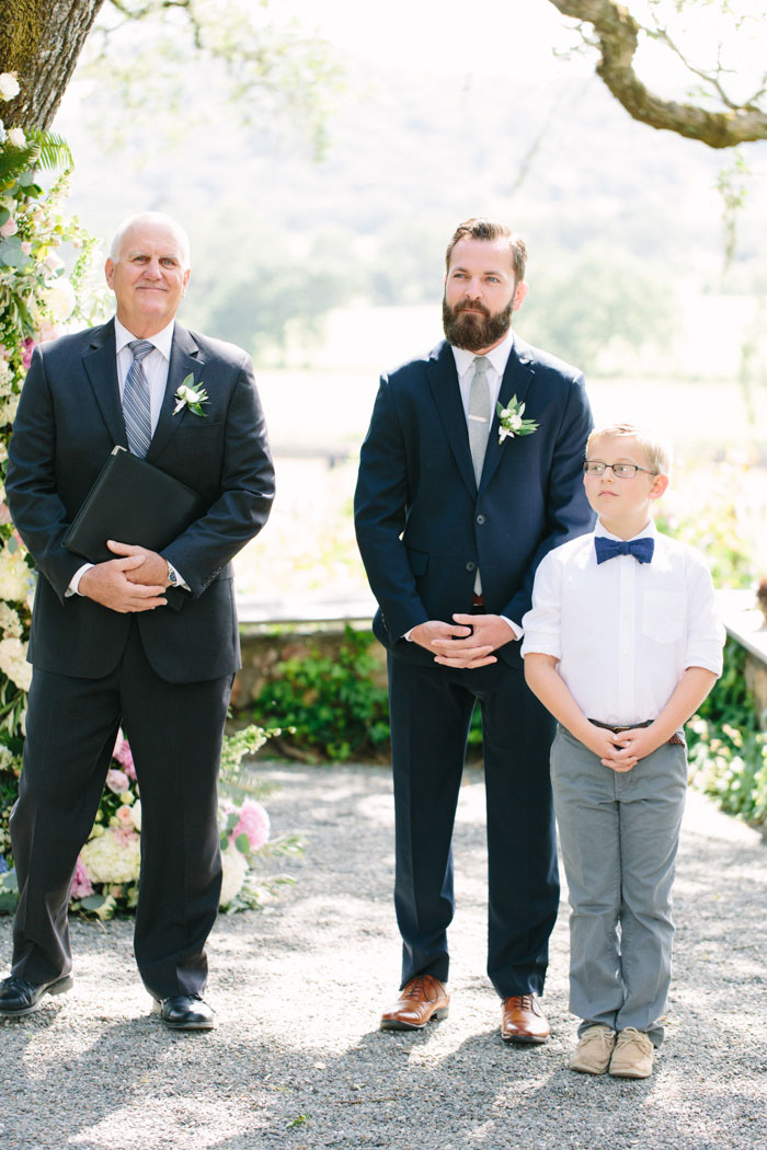 groom and son waiting at the altar