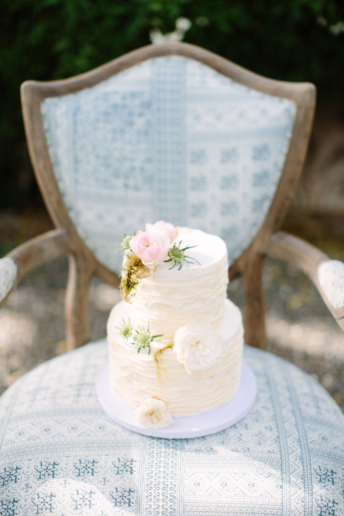 tiered wedding cake on chair