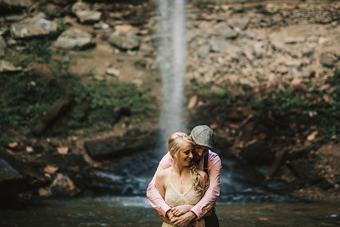 wedding portrait in front of waterfall 