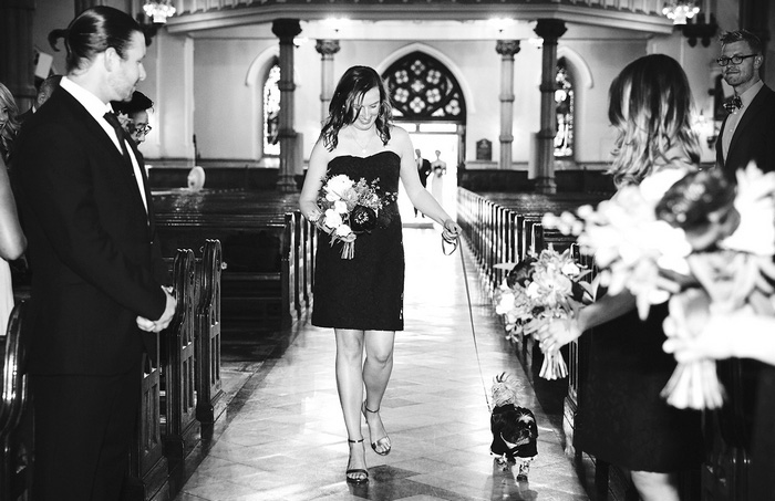 bridesmaid walking down the aisle with dog