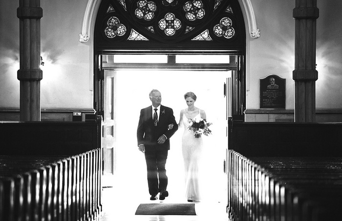 bride walking down the aisle with her father