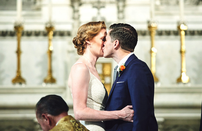 bride and groom first kiss