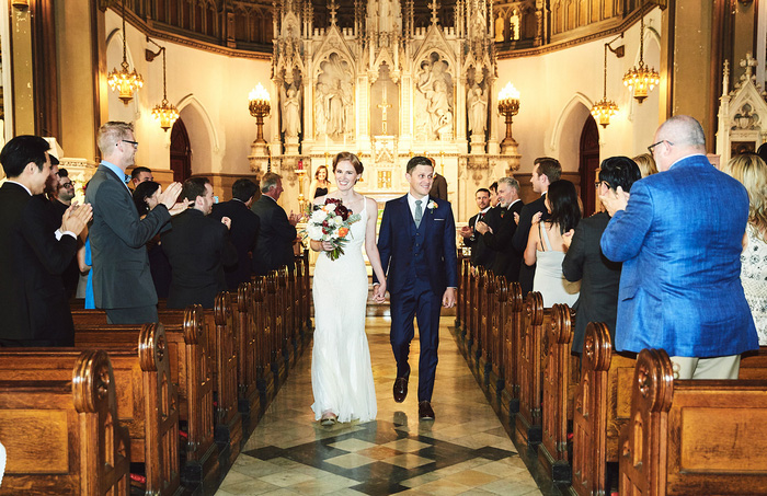 bride and groom walking up the aisle