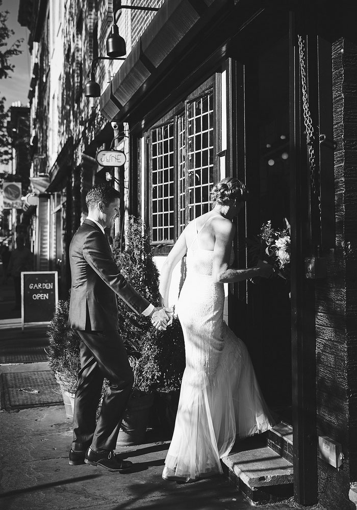 bride and groom entering restaurant