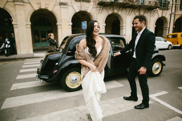 bride wearing fur stole crossing street