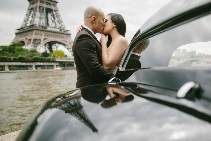 bride and groom kissing in front of Eiffel Tower 